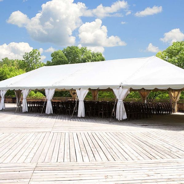large tent with chairs underneath for event
