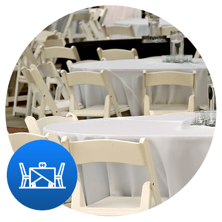 white tables and chairs at an event