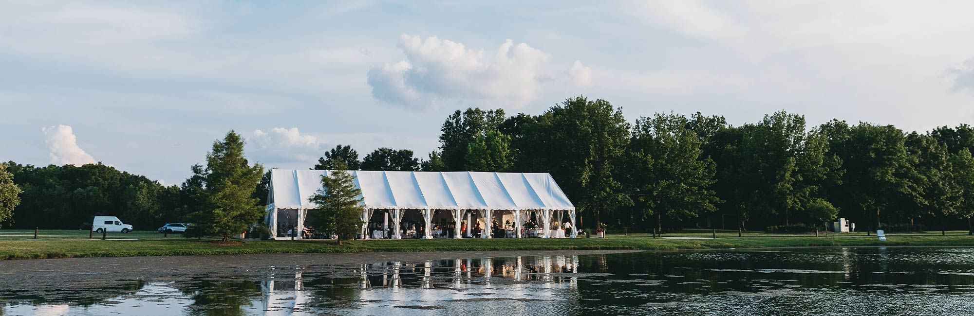a tented party by a lake