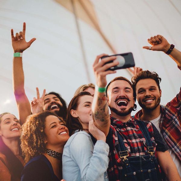 group of friends taking photo at festival