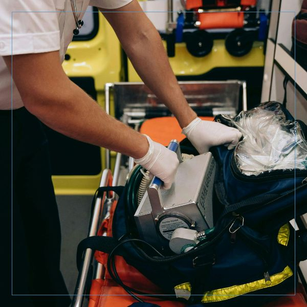 a paramedic pulling out a defibulator Paramedic (4).jpg