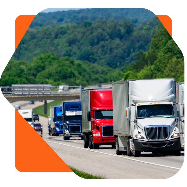 Image of multiple trucks on a road driving