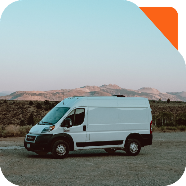 HVAC van driving with mountains in the background