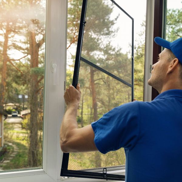 man fixing windows