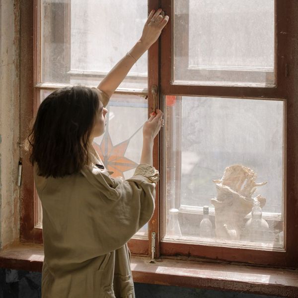 woman at vintage window