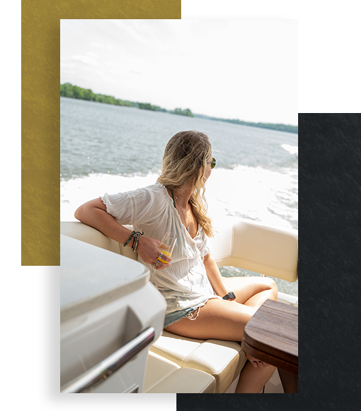 A young woman looking at the view from a yacht 