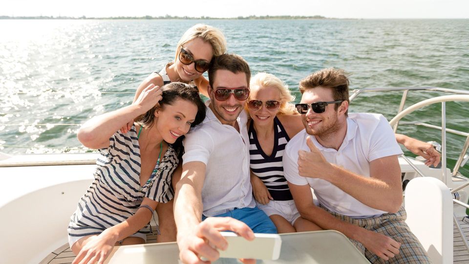 group of friends on yacht