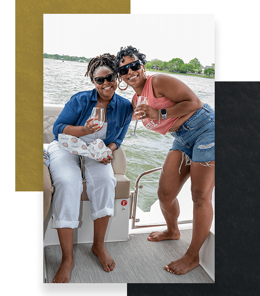 2 women smiling on yacht