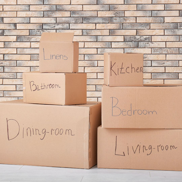 Boxes labeled with different rooms in house