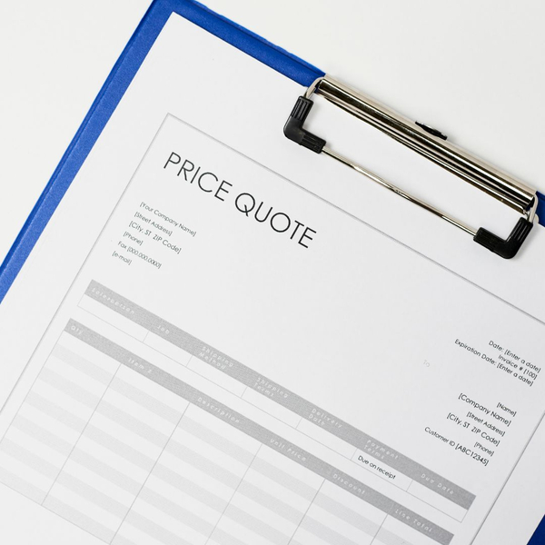 Document with price quote, attached to clipboard Document with price quote, attached to clipboard
