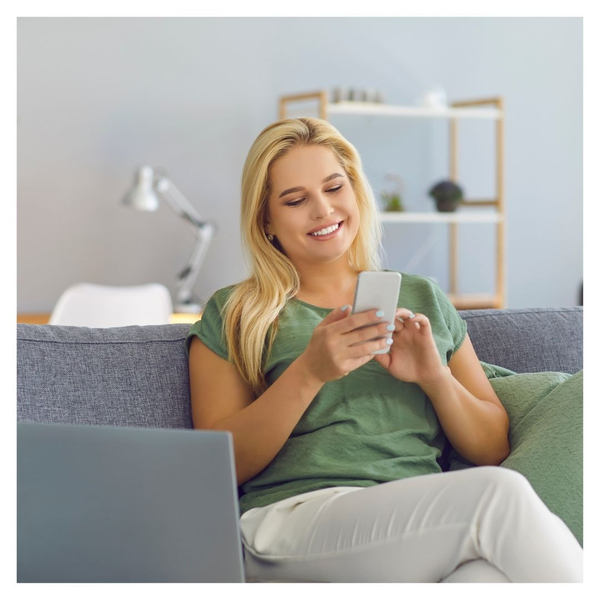 person on phone on couch