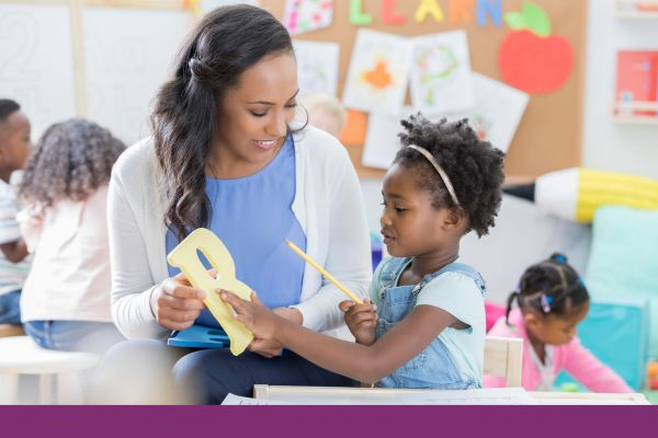 girl working with teacher