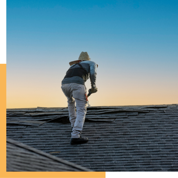 roofer removing damaged roof