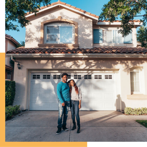 happy homeowner outside home