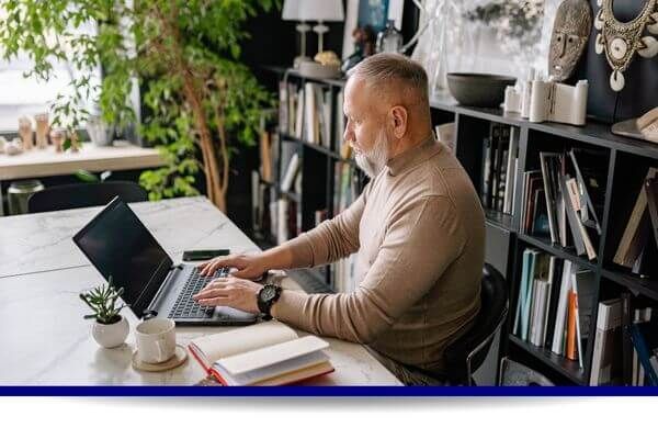 senior working on computer