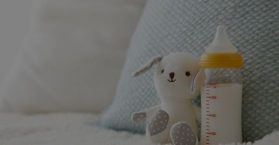 bottle and stuffy on chair bottle and stuffy on chair