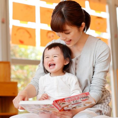 teacher reading to toddler