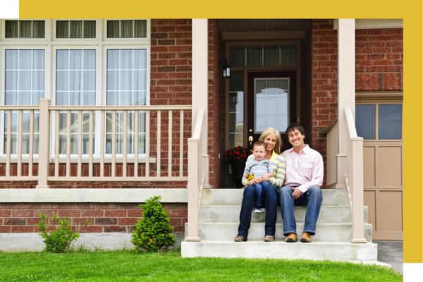 family sitting on front porch steps