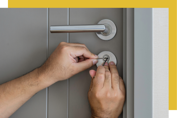 locksmith working on door