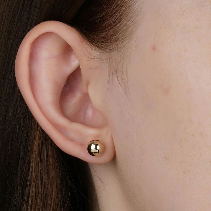 A close-up professional photograph of a healthy ear, representing specialized treatment for chronic ear problems.