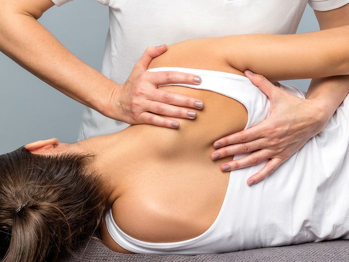 licensed massage therapist providing rehabilitative massage