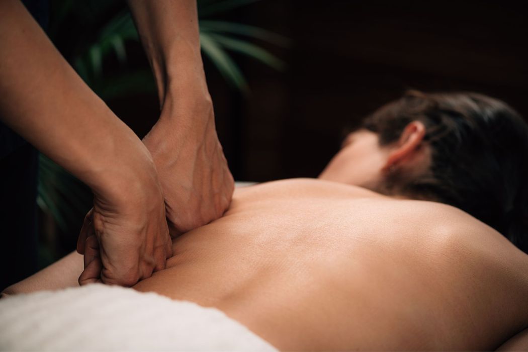 A client experiencing a medical massage in a highly rated Fort Collins massage center