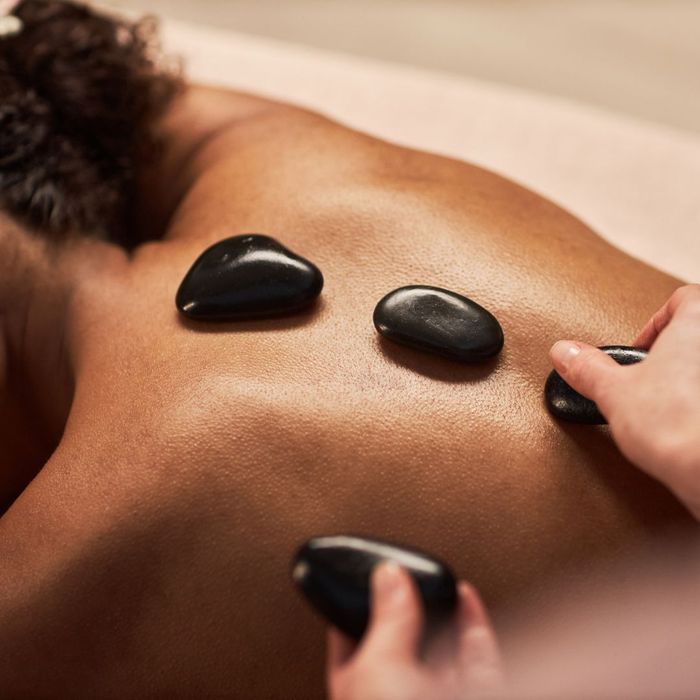 A picture of a client receiving hot stone massage in Fort Collins Hot Stone Massage