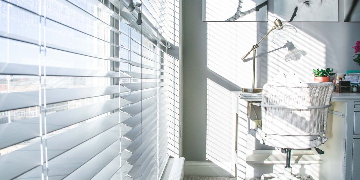 Closeup of white blinds in an office
