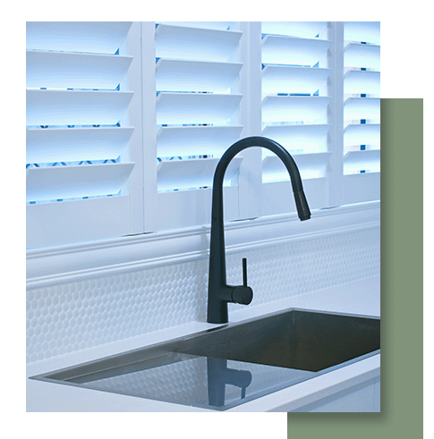  Image of white shutter on a window above a kitchen sink