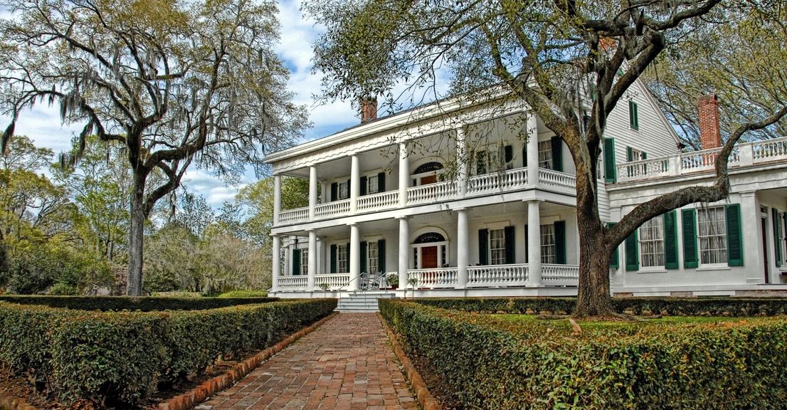 old house with plantation shutters