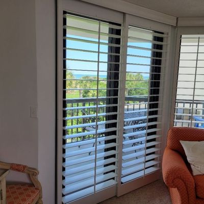 side room with plantation blinds