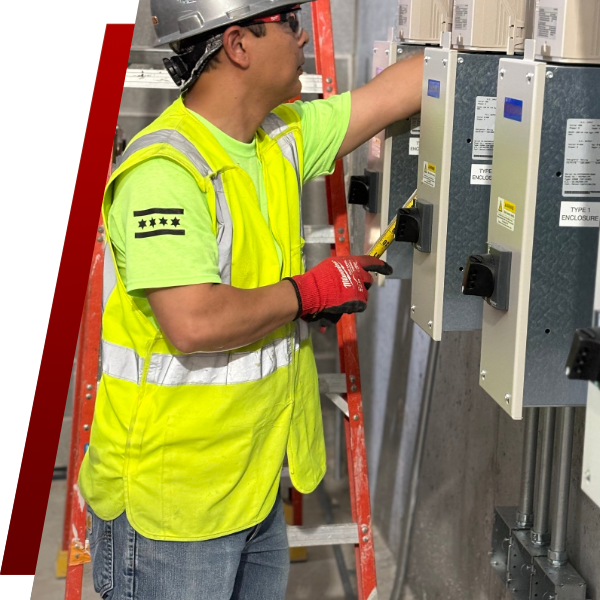 A wide-angle view of a skilled industrial electrician in a hard hat and safety vest, meticulously inspecting a complex network of cables and conduits on a large factory wall, with heavy machinery visible in the background. A wide-angle view of a skilled industrial electrician in a hard hat and safety vest, meticulously inspecting a complex network of cables and conduits on a large factory wall, with heavy machinery visible in the background.