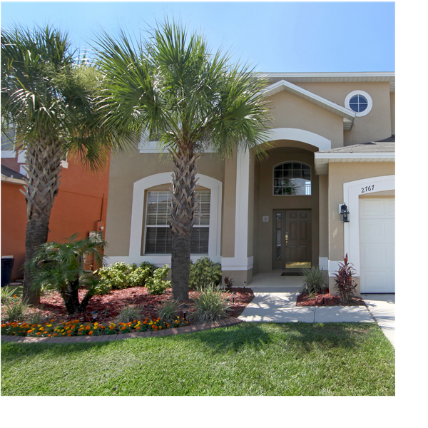florida house with well-kept lawn, landscaped garden