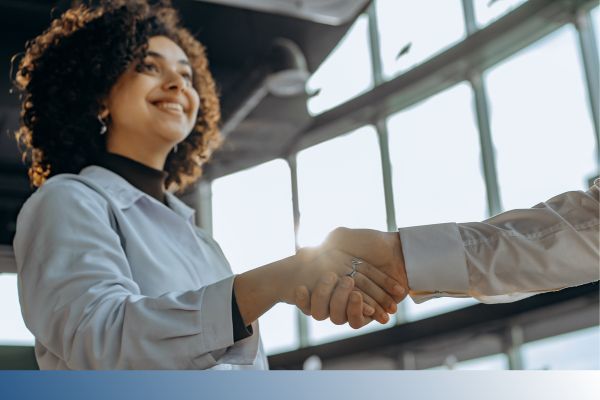 woman shaking hands woman shaking hands