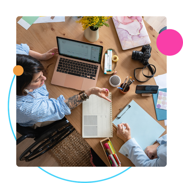 overhead view of coworkers at desk collaborating