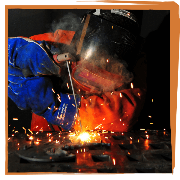 welder with mask and gloves