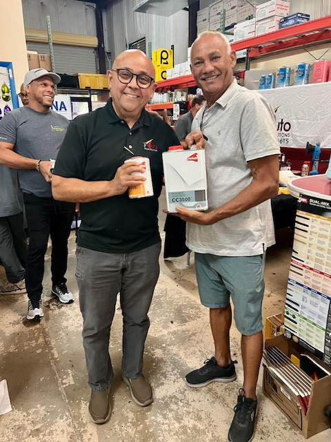 Hernan Medina of Auto Color Soliutions with Alvaro, the Raffle Winner of the Night.jpg
