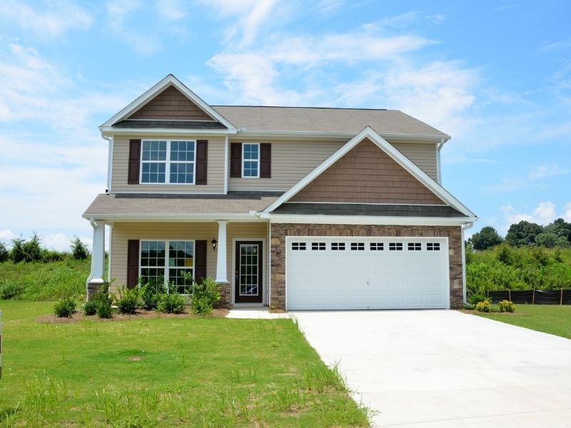 a newly built house with newly installed landscaping