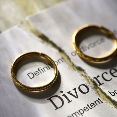 Rings and split paper saying divorce