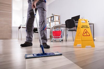Janitor mopping an office floor