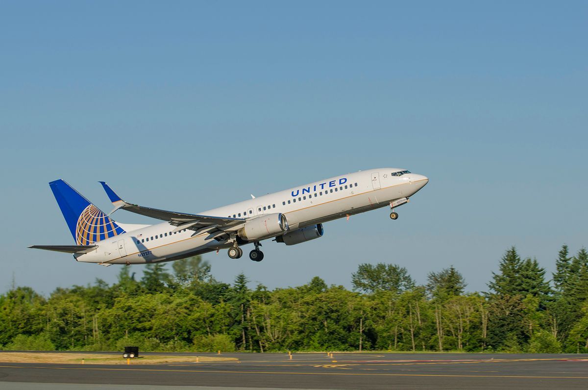 The final image of a 737 United passenger jet lifting off with newly installed winglet and scimitar flight surfaces installed at Boeing Field