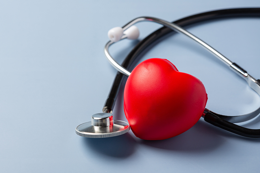 image of a stethoscope and toy heart