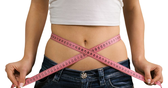 image of a woman measuring her stomach