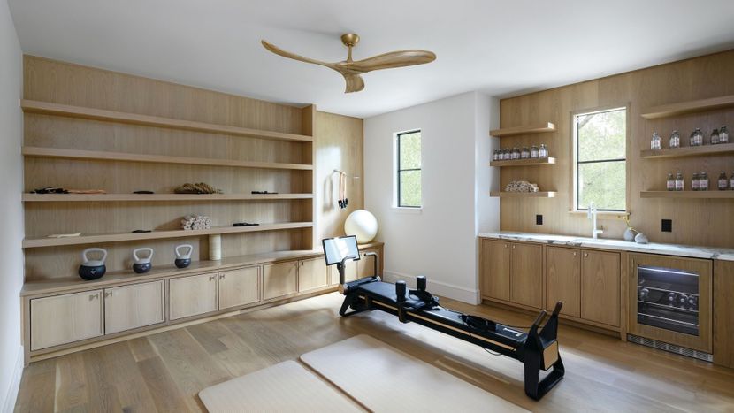 Gym with wood ceiling fan and wooden accents. Gym with wood ceiling fan and wooden accents.