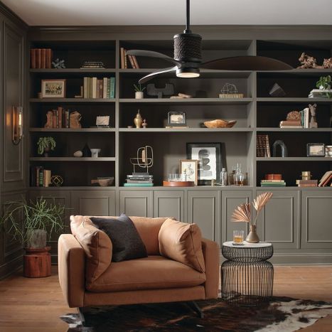 Dark ceiling fan in modern study.