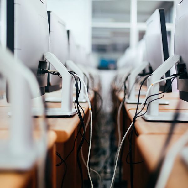 backend of two rows of computer monitors