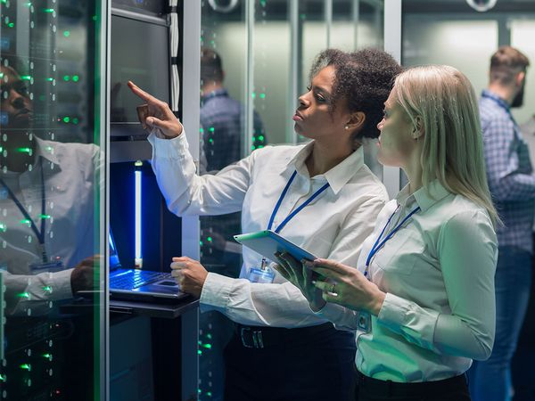  two women discussing servers