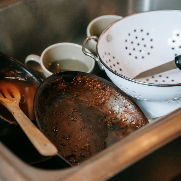 Dirty dishes in sink.