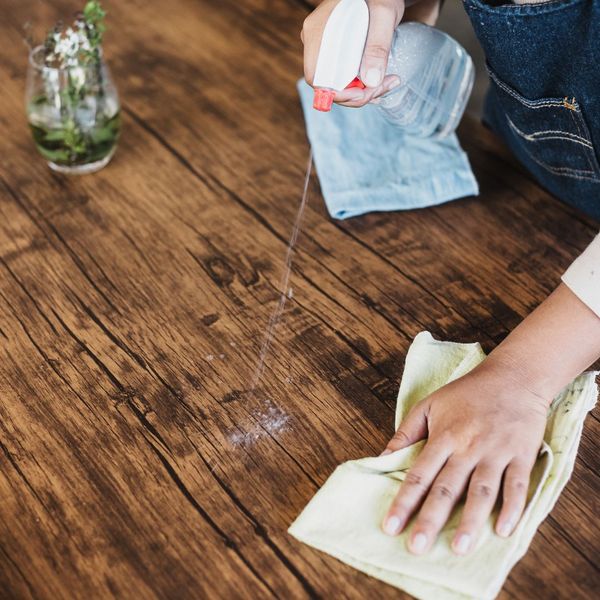 Wiping down kitchen counter.