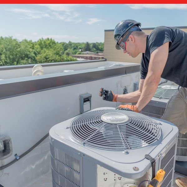 working on commercial roof ACs